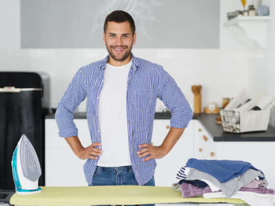 man preparing iron clothes